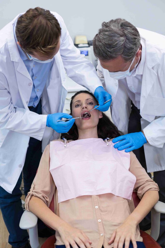 dentists examining a female patient