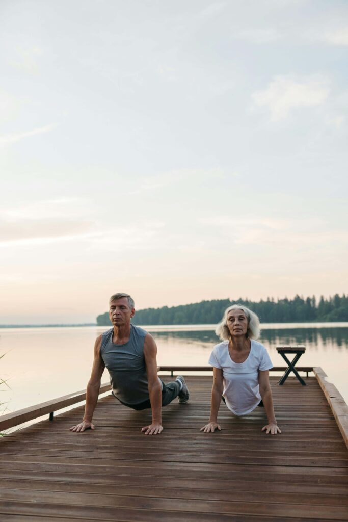 old man and woman doing workout